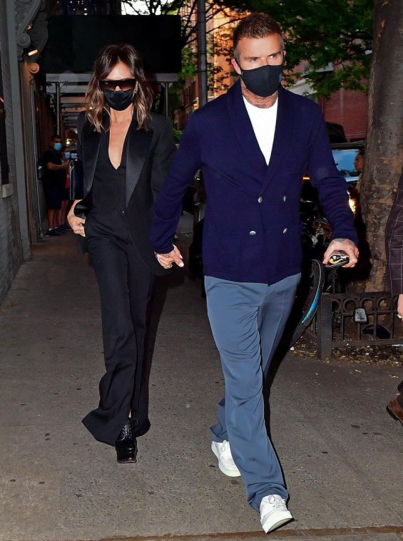 Victoria Beckham in a black suit with David Beckham at a dinner in New York