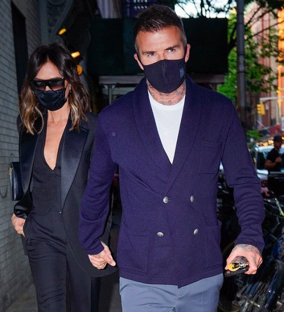 Victoria Beckham in a black suit with David Beckham at a dinner in New York