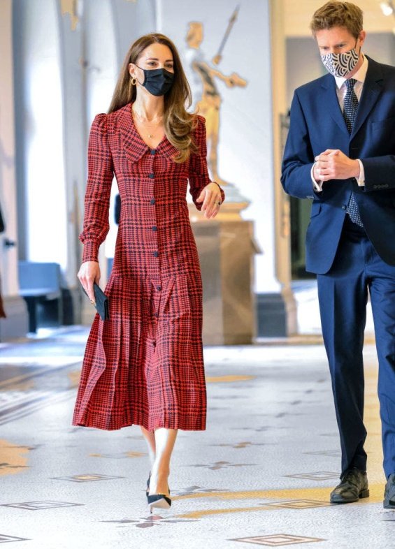 Kate Middleton in a plaid red dress for a visit to a museum in London