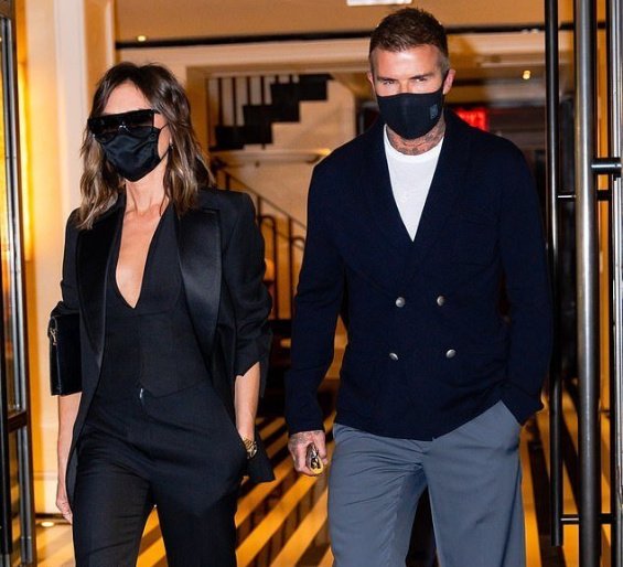 Victoria Beckham in a black suit with David Beckham at a dinner in New York