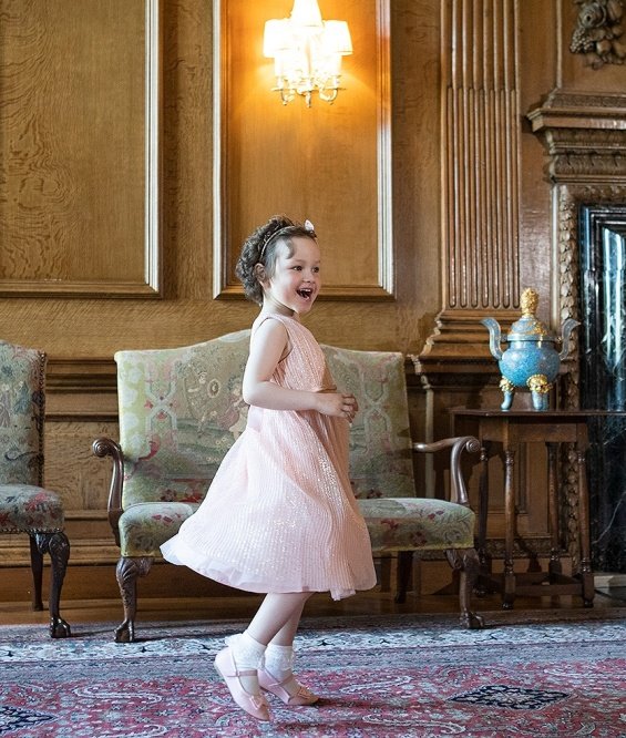 Kate Middleton in a pink dress for a meeting with a little girl suffering from cancer