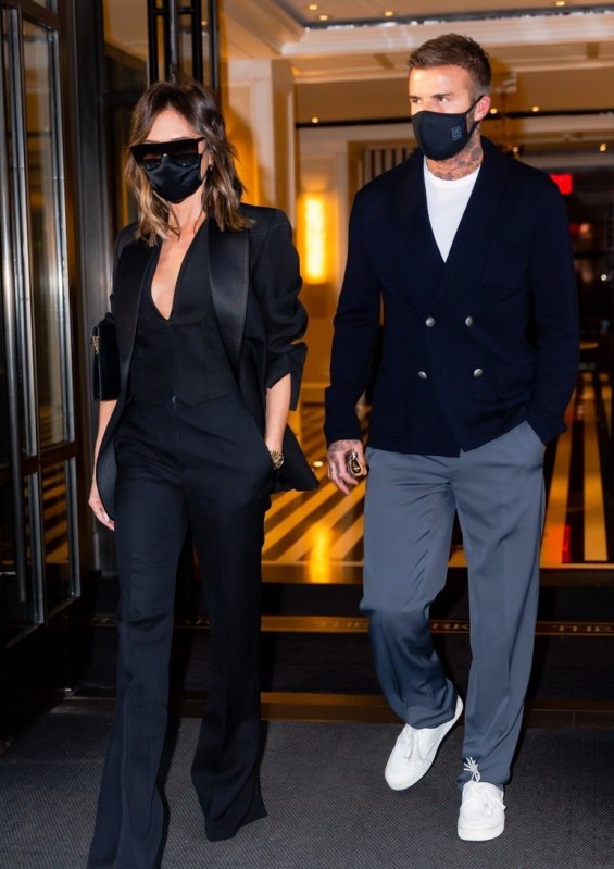 Victoria Beckham in a black suit with David Beckham at a dinner in New York