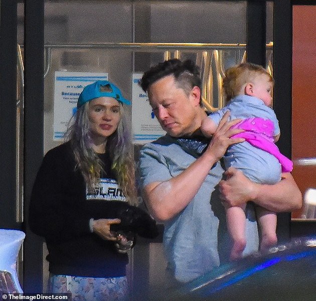 Elon Musk with his wife and little son at the airport