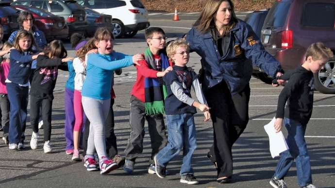 A sixth-grader in the United States shot dead three people at her school