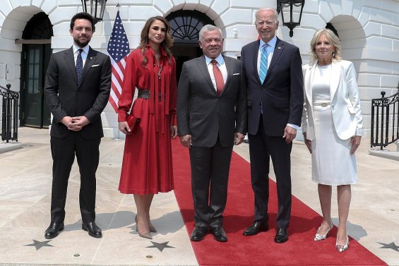 Queen Rania in a red dress next to Jill Biden at the White House - Elegant Ladies