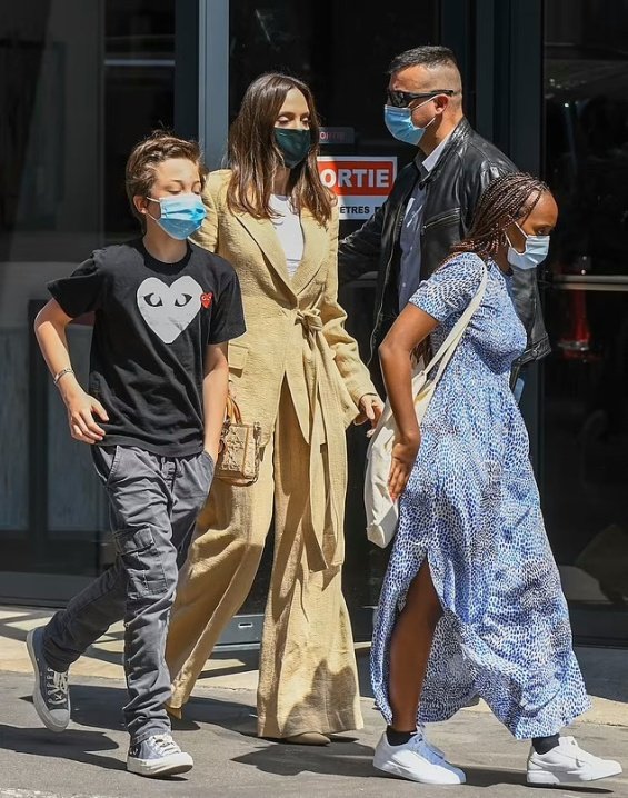 Angelina Jolie in several stylings with children in Paris