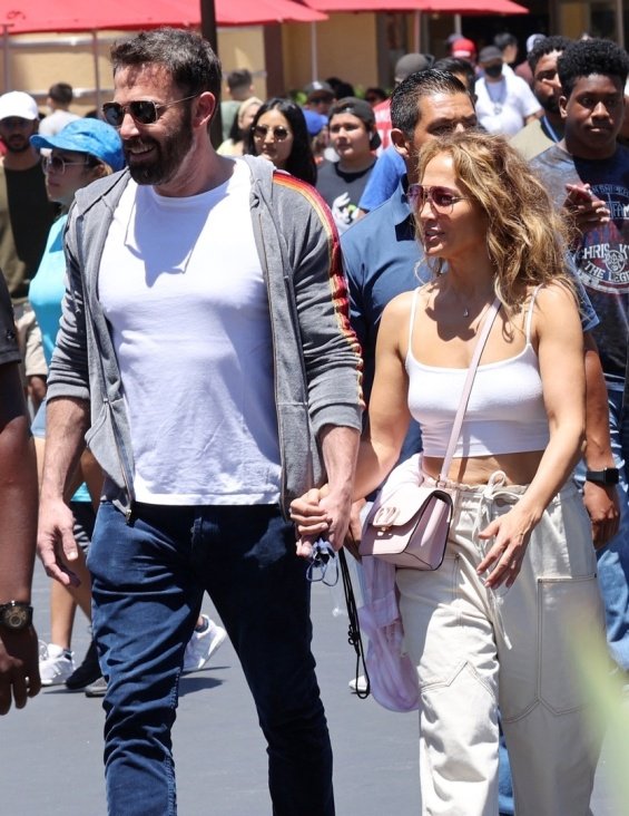 Jennifer Lopez and Ben Affleck smiling and happy with the kids at the amusement park