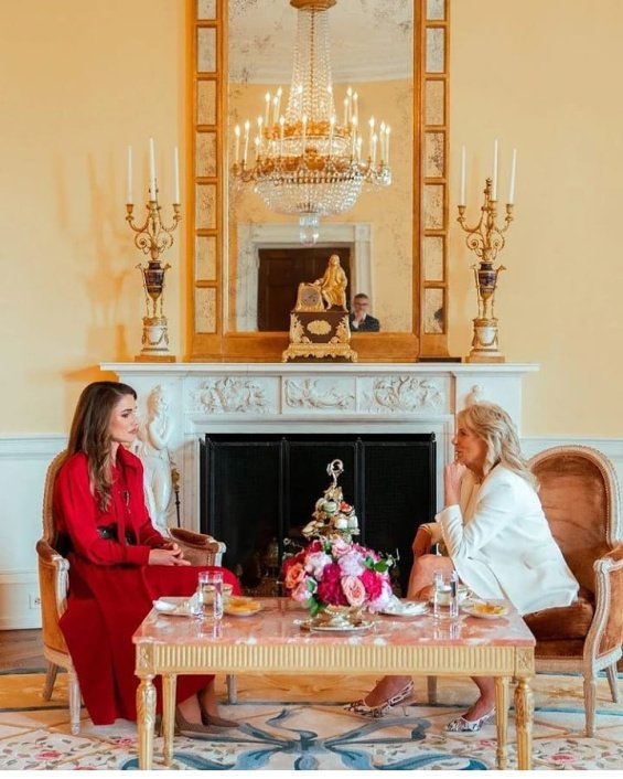 Queen Rania in a red dress next to Jill Biden at the White House - Elegant Ladies