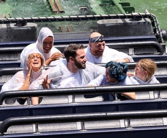 Jennifer Lopez and Ben Affleck smiling and happy with the kids at the amusement park