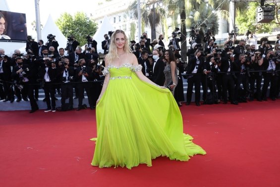 Charming blogger Chiara Ferragni in a light green dress on the red carpet in Cannes