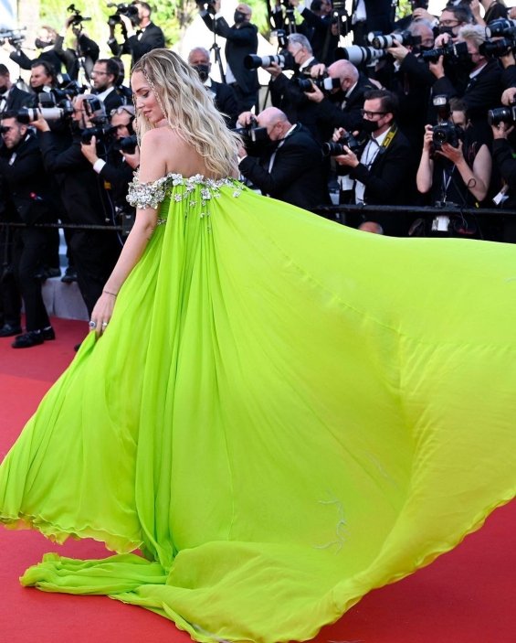 Charming blogger Chiara Ferragni in a light green dress on the red carpet in Cannes