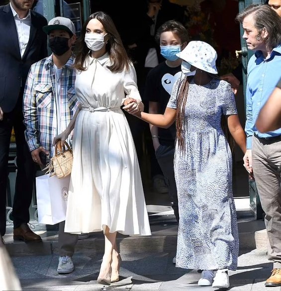 Angelina Jolie in several stylings with children in Paris