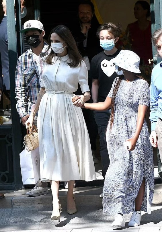 Angelina Jolie in several stylings with children in Paris