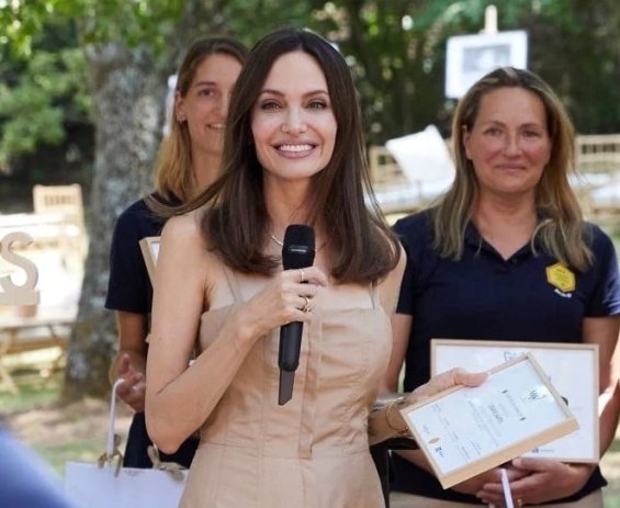 Angelina Jolie in several stylings with children in Paris