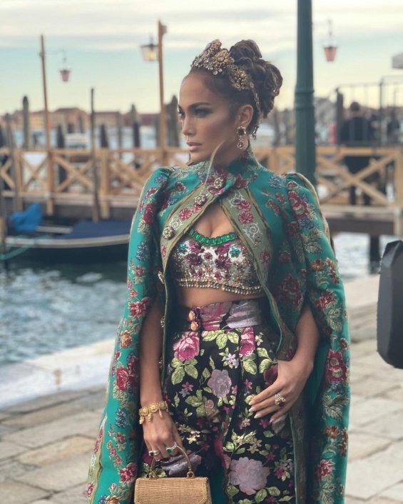 Jennifer Lopez in a floral outfit with a gown at the fashion show of Dolce & Gabbana in Venice