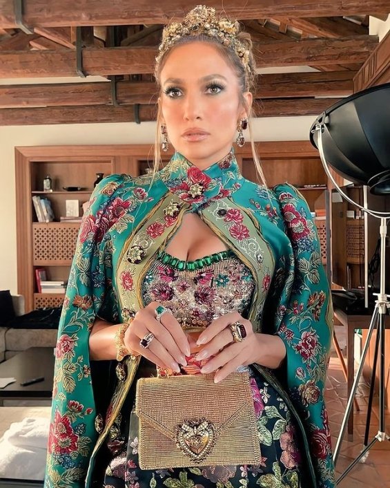 Jennifer Lopez in a floral outfit with a gown at the fashion show of Dolce & Gabbana in Venice