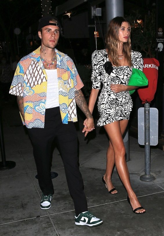 Hailey Bieber fashionable in a mini dress at a dinner with Justin in Beverly Hills