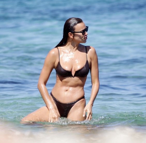 Irina Shayk enjoys the beach in Ibiza while Bradley Cooper takes care of their daughter