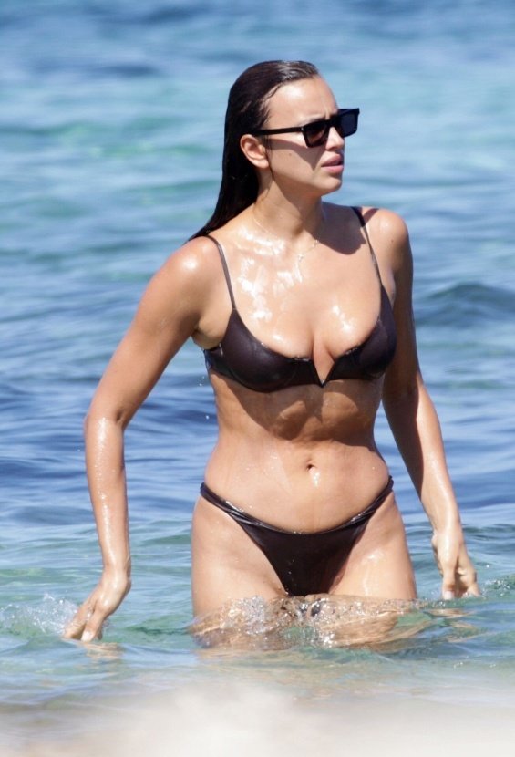 Irina Shayk enjoys the beach in Ibiza while Bradley Cooper takes care of their daughter