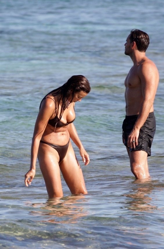 Irina Shayk enjoys the beach in Ibiza while Bradley Cooper takes care of their daughter