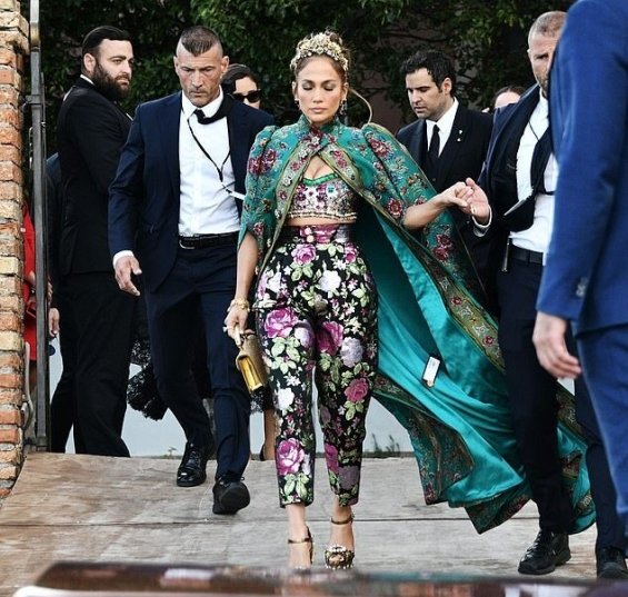 Jennifer Lopez in a floral outfit with a gown at the fashion show of Dolce & Gabbana in Venice