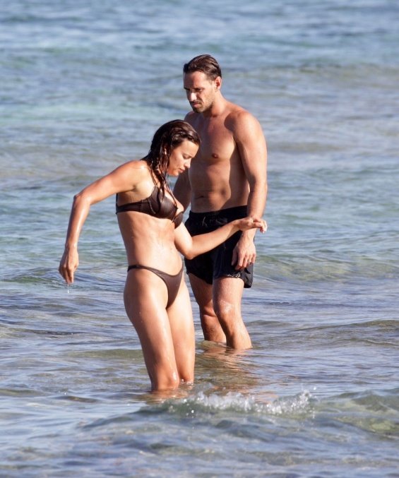 Irina Shayk enjoys the beach in Ibiza while Bradley Cooper takes care of their daughter