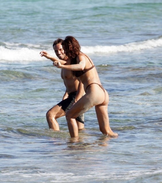 Irina Shayk enjoys the beach in Ibiza while Bradley Cooper takes care of their daughter