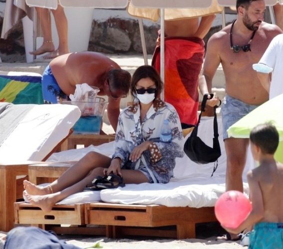 Irina Shayk enjoys the beach in Ibiza while Bradley Cooper takes care of their daughter