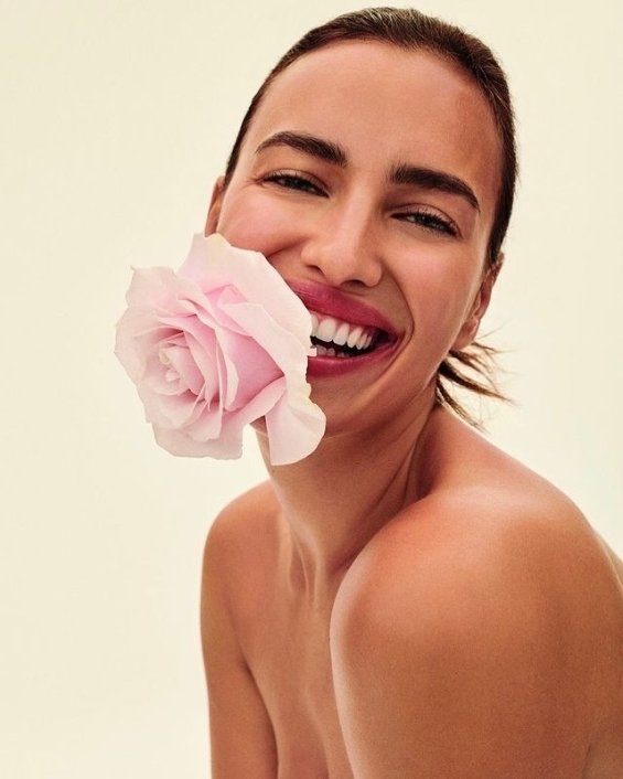 Irina Shayk poses with roses in the photo session for the new Replay collection