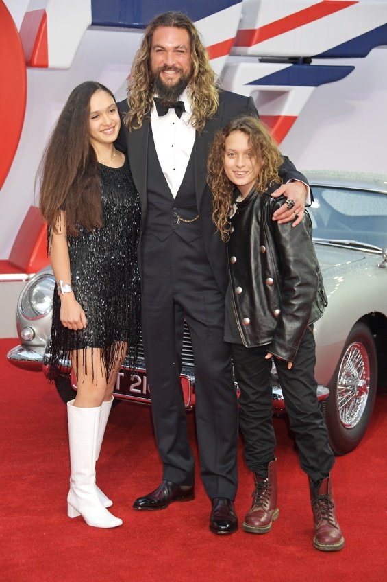Jason Momoa with two children on the red carpet at the premiere of No Time To Die