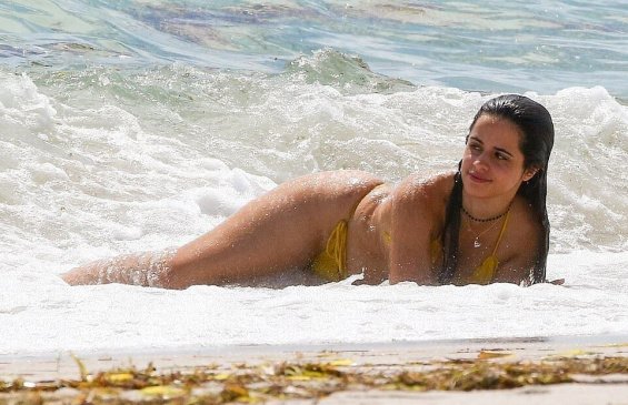 Camila Cabello in a yellow bikini enjoys the beach in Miami