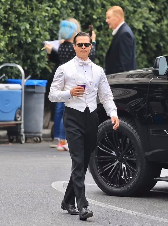 Hollywood seducer: Brad Pitt ultra sleek in suit photographed on the set of the new movie