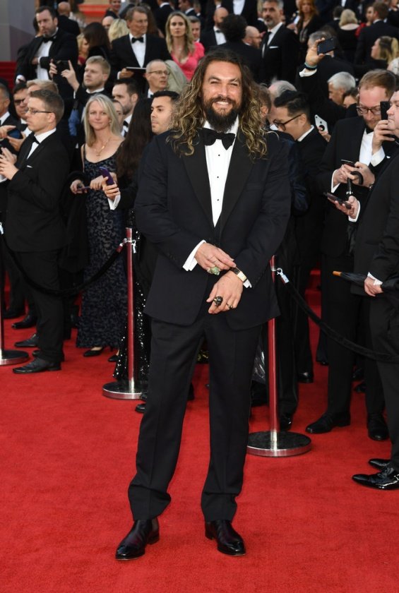 Jason Momoa with two children on the red carpet at the premiere of No Time To Die