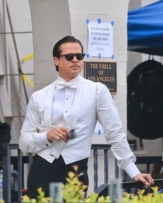 Hollywood seducer: Brad Pitt ultra sleek in suit photographed on the set of the new movie