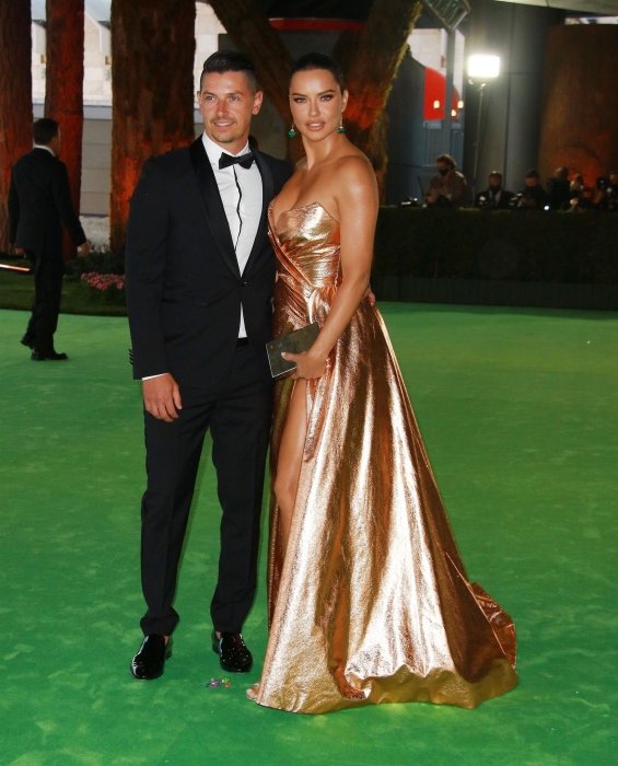 Adriana Lima in a gold dress with her new boyfriend at the gala