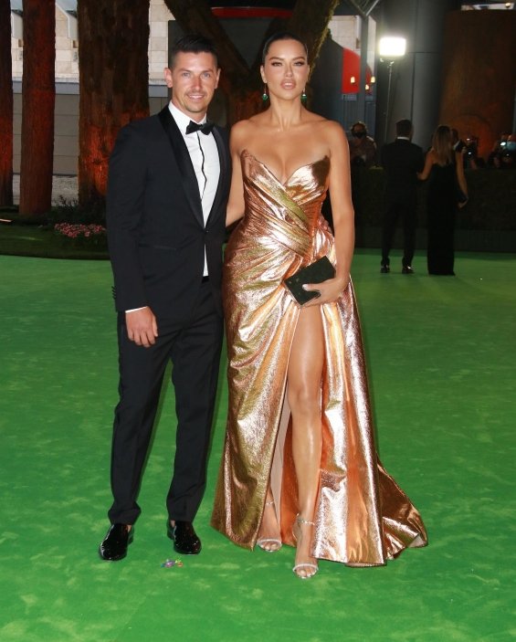 Adriana Lima in a gold dress with her new boyfriend at the gala