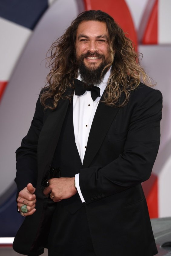 Jason Momoa with two children on the red carpet at the premiere of No Time To Die