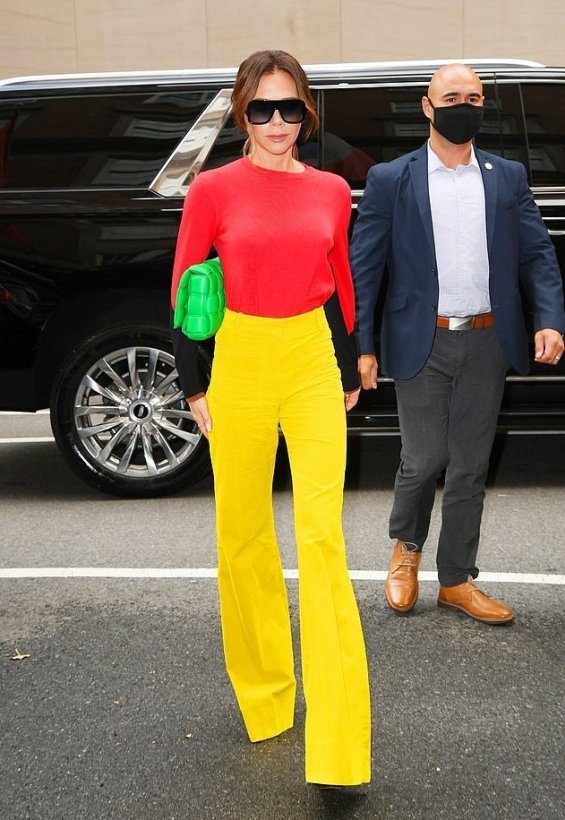 Victoria Beckham in colorful autumn styling with her signature