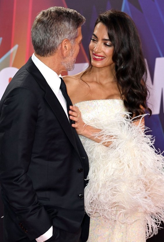 George and Amal Clooney glamorous couple on the red carpet in London