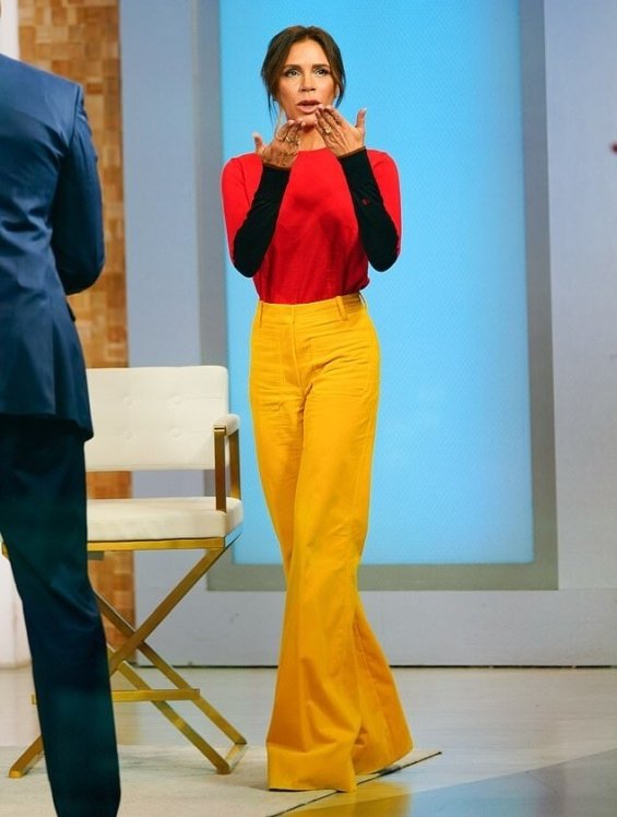 Victoria Beckham in colorful autumn styling with her signature
