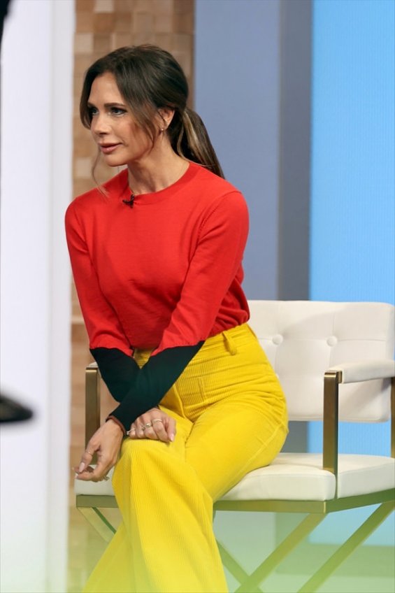 Victoria Beckham in colorful autumn styling with her signature