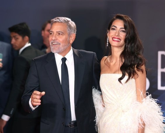 George and Amal Clooney glamorous couple on the red carpet in London