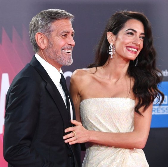 George and Amal Clooney glamorous couple on the red carpet in London