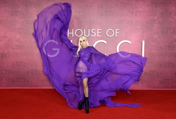 Lady Gaga strikes in a purple dress by Gucci at the premiere of House of Gucci