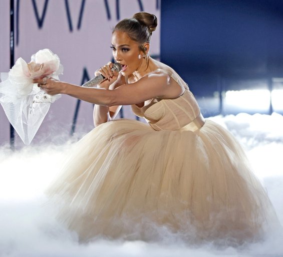 Jennifer Lopez as a bride in a creation by Dolce & Gabbana sang the song from the new movie Marry Me