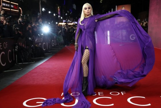 Lady Gaga strikes in a purple dress by Gucci at the premiere of House of Gucci