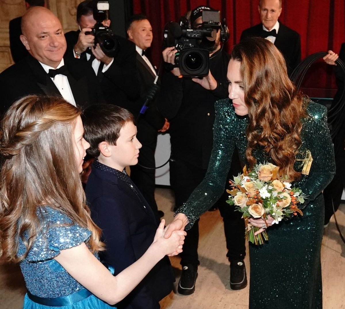 Duchess Catherine in an emerald green dress at a London event