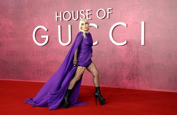 Lady Gaga strikes in a purple dress by Gucci at the premiere of House of Gucci