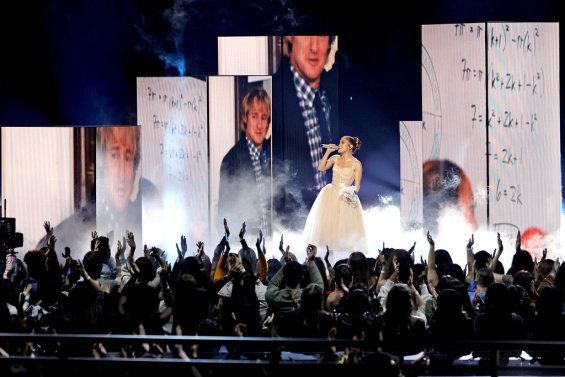 Jennifer Lopez as a bride in a creation by Dolce & Gabbana sang the song from the new movie Marry Me