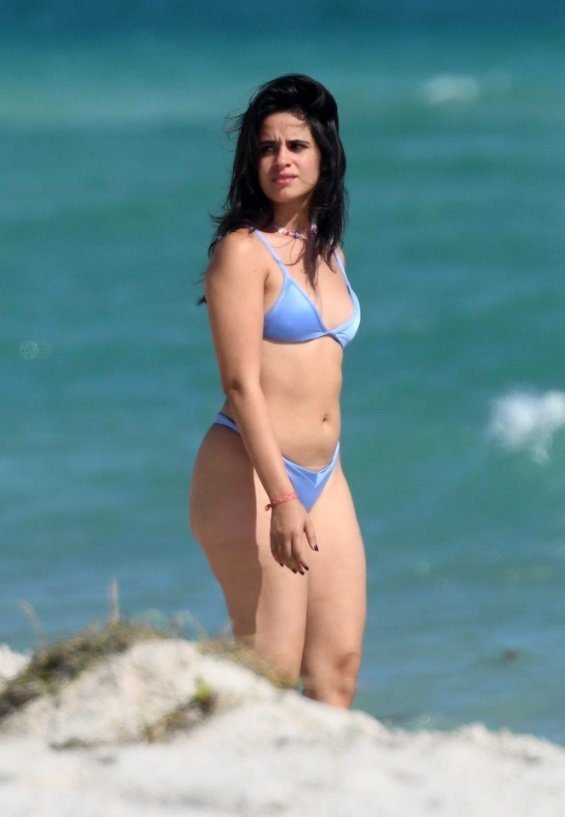 Camila Cabello in a blue bikini kisses Shawn Mendes on the beach in Miami